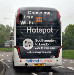 Novel advertising on the back of a National Express coach - imagine trying to explain this to the police officer as you're pulled over for using your wifi enabled device at the wheel? Image credit: .Camilo on Flickr.